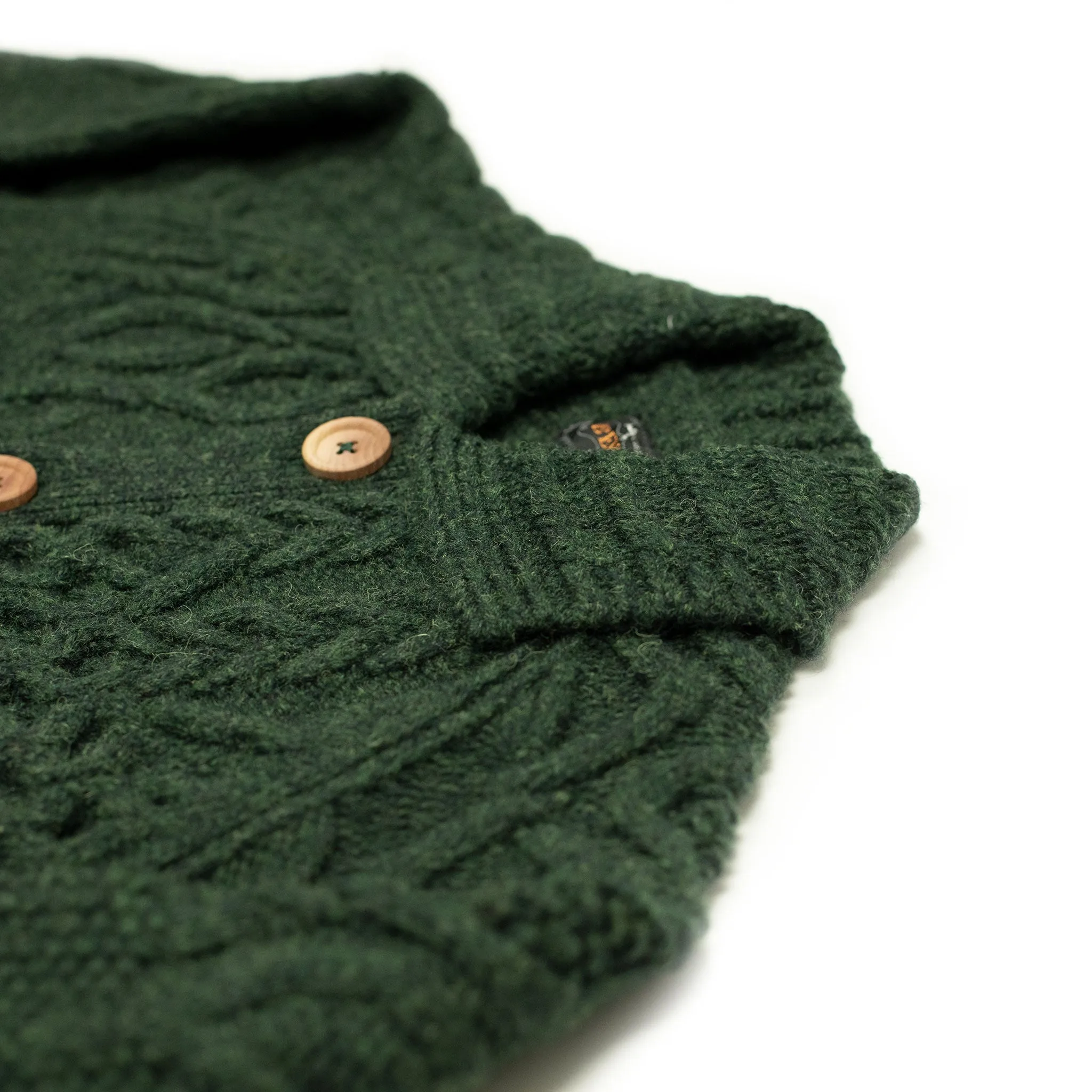 Crazy cable knit Aran cardigan in racing green wool