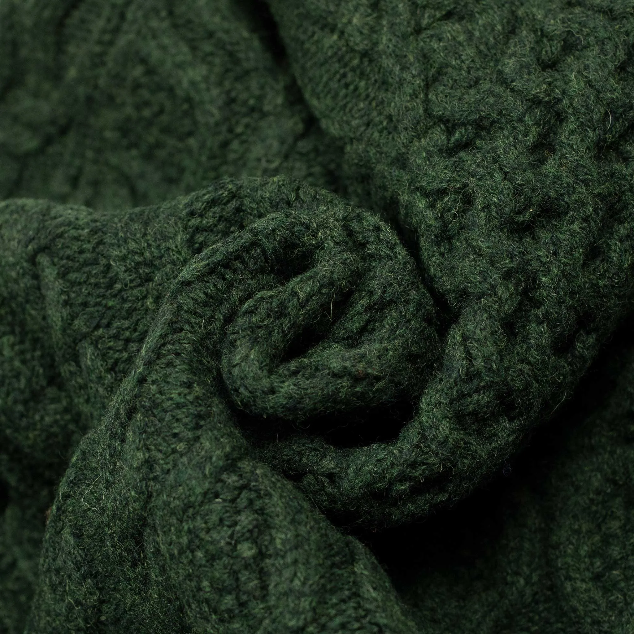 Crazy cable knit Aran cardigan in racing green wool