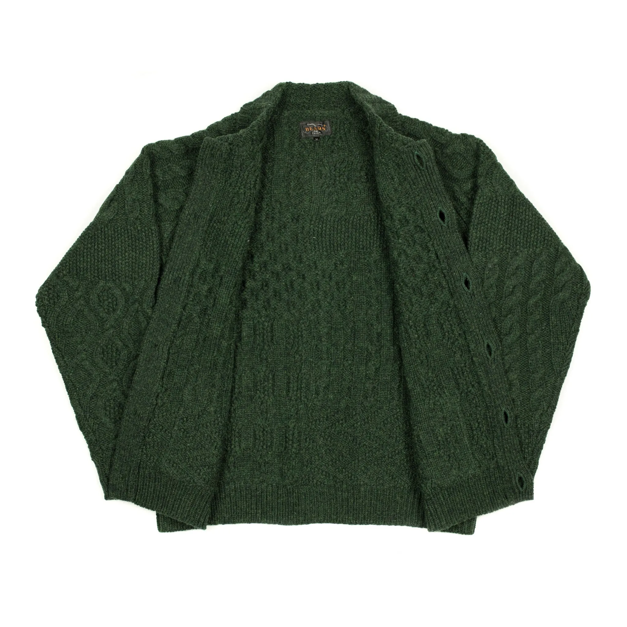 Crazy cable knit Aran cardigan in racing green wool
