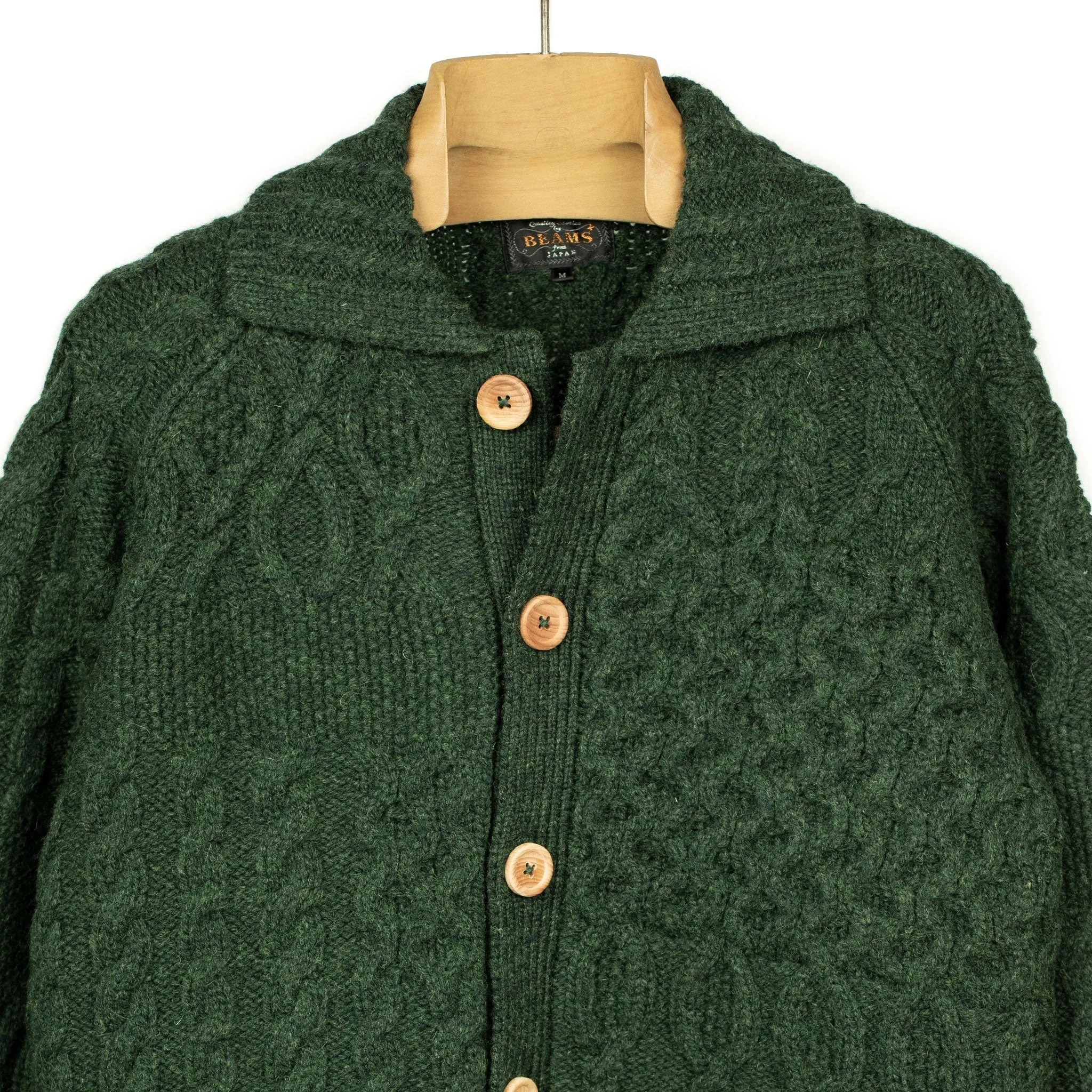 Crazy cable knit Aran cardigan in racing green wool